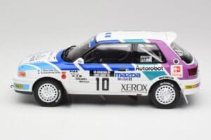 Mazda 323 GTX #10 T. Makinen / S. Harjanne 1000 Lakes Rally 1991 Otto 1:18 OT1099 Gyanta – 3. kép a 6-ből